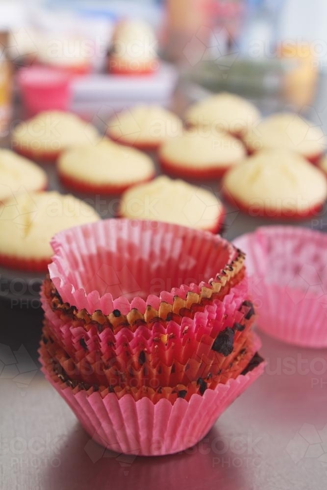Image of Close up of used patties to make cupcakes in a bakery - Austockphoto mini cupcake patties