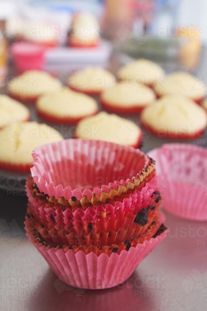 Close up of used patties to make cupcakes in a bakery - Australian Stock Image