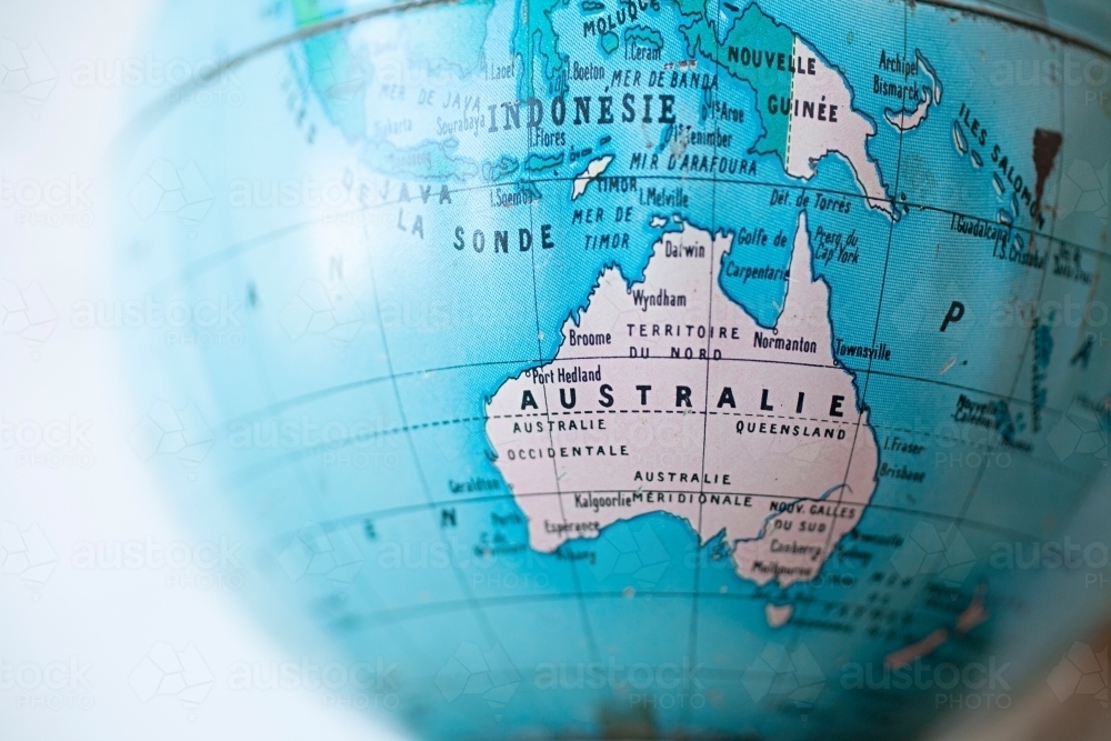 Close up of world globe with map of Australia - written in french - Australian Stock Image