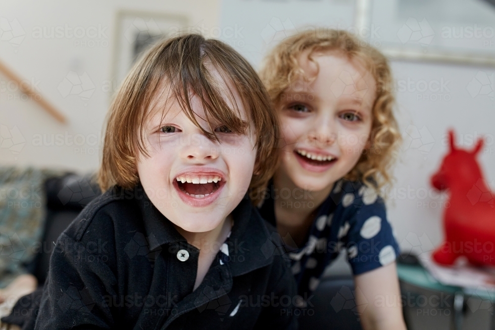 Close up of young boy and girl smiling - Australian Stock Image