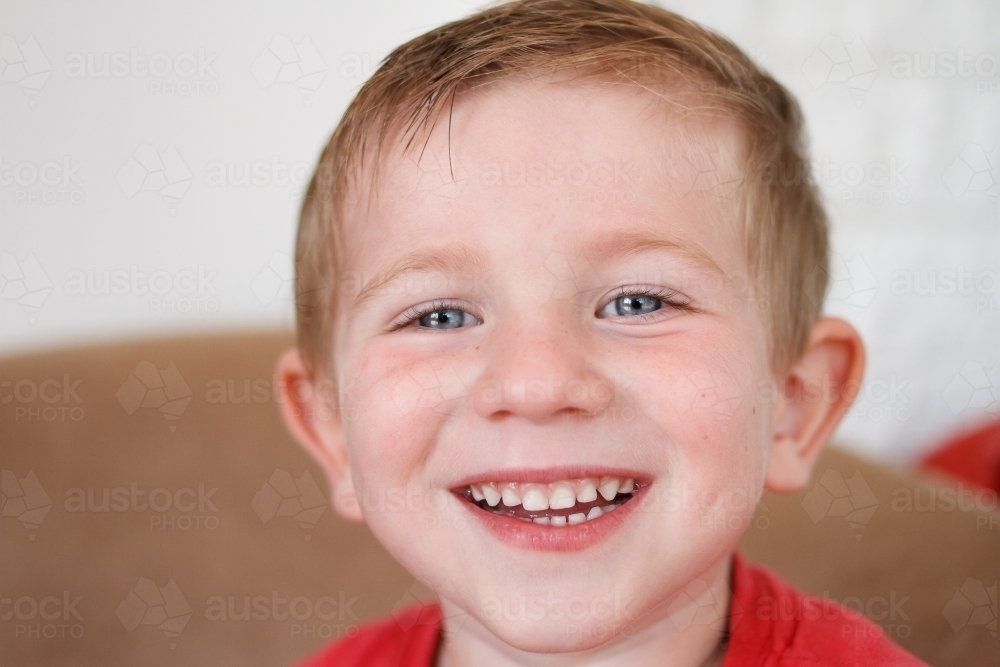 Close up of young boy with a big smile - Australian Stock Image
