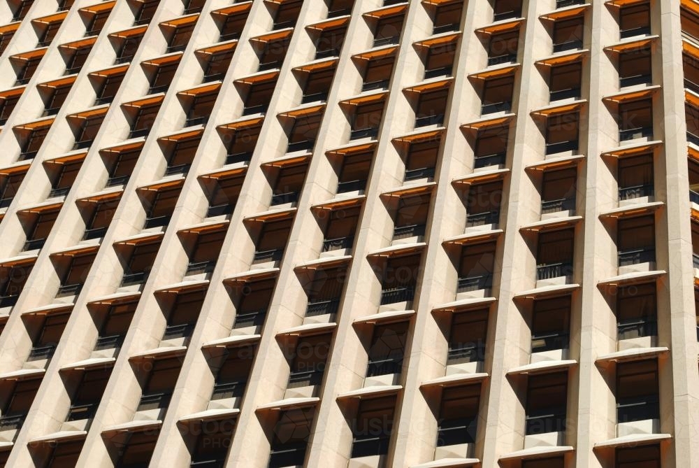 Close-up photo of the windows of a modern office building - Australian Stock Image