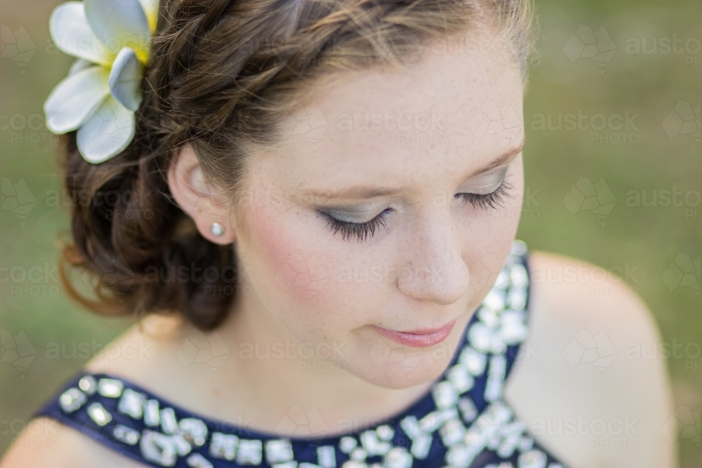 Close up portrait of a beautiful girl looking down - Australian Stock Image