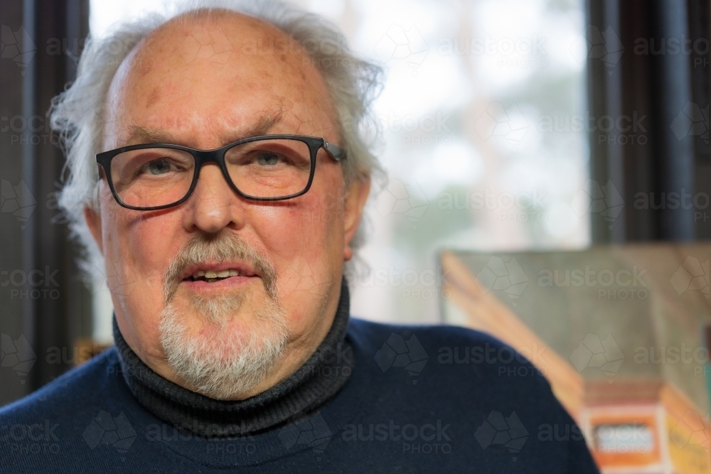 Close up portrait of a distinguished man wearing glasses - Australian Stock Image