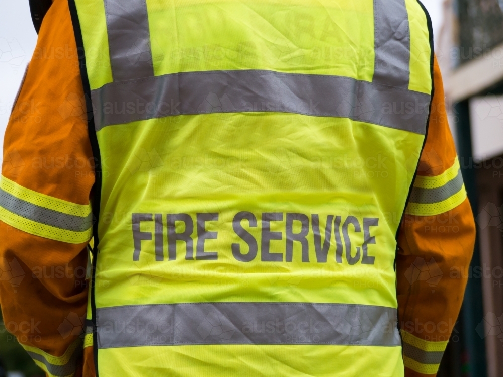 Close up rear view of rural fire fighter in uniform - Australian Stock Image