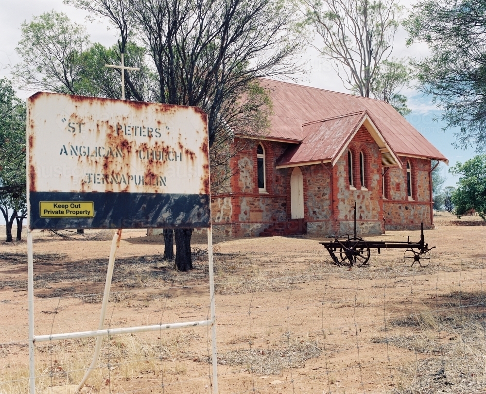 Close up shot of a church with a rusty and old signage - Australian Stock Image