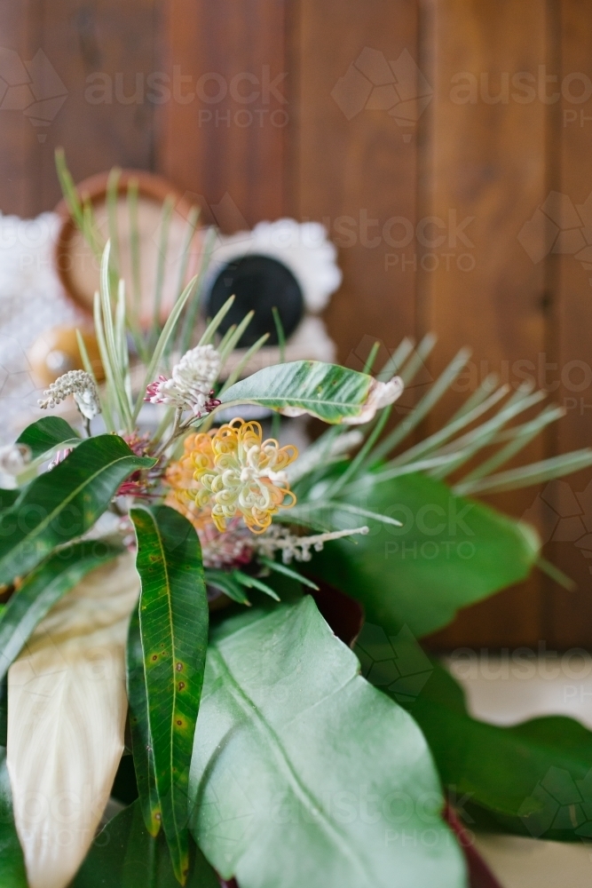 Close up shot of a flower arrangement and plant leaves - Australian Stock Image