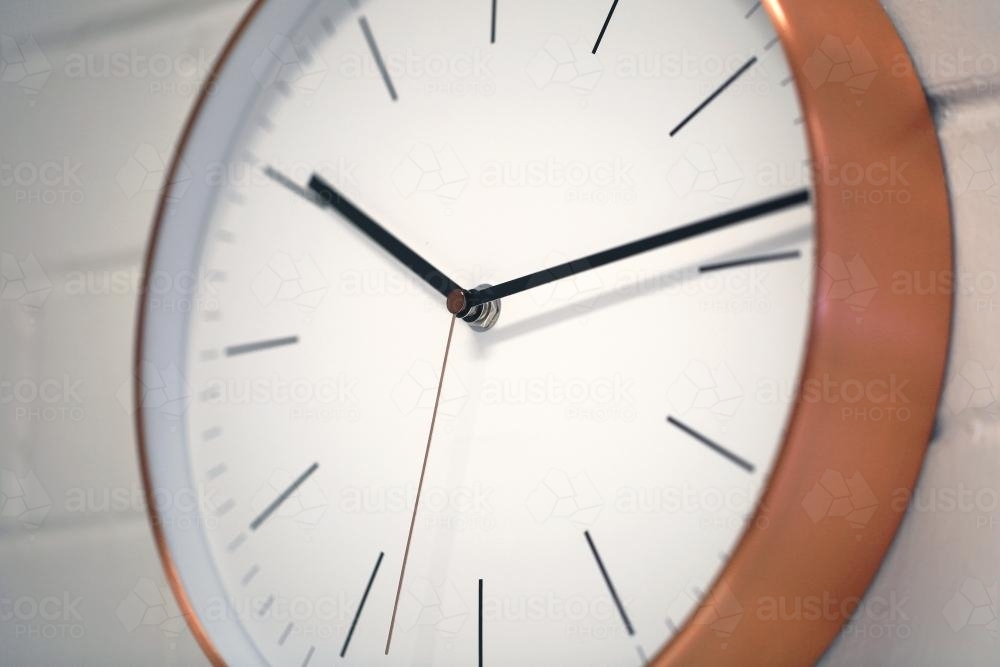 Close up shot of a round wall clock - Australian Stock Image