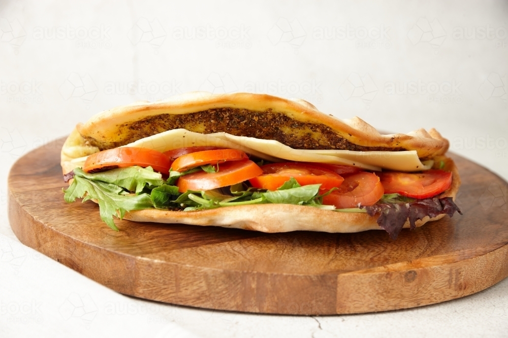 close up shot of cheese and tomato zaatar - Australian Stock Image