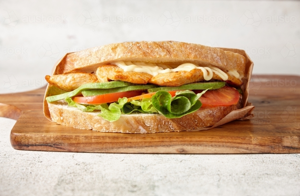 Image of close up shot of chickenavocadojumbosandwich Austockphoto
