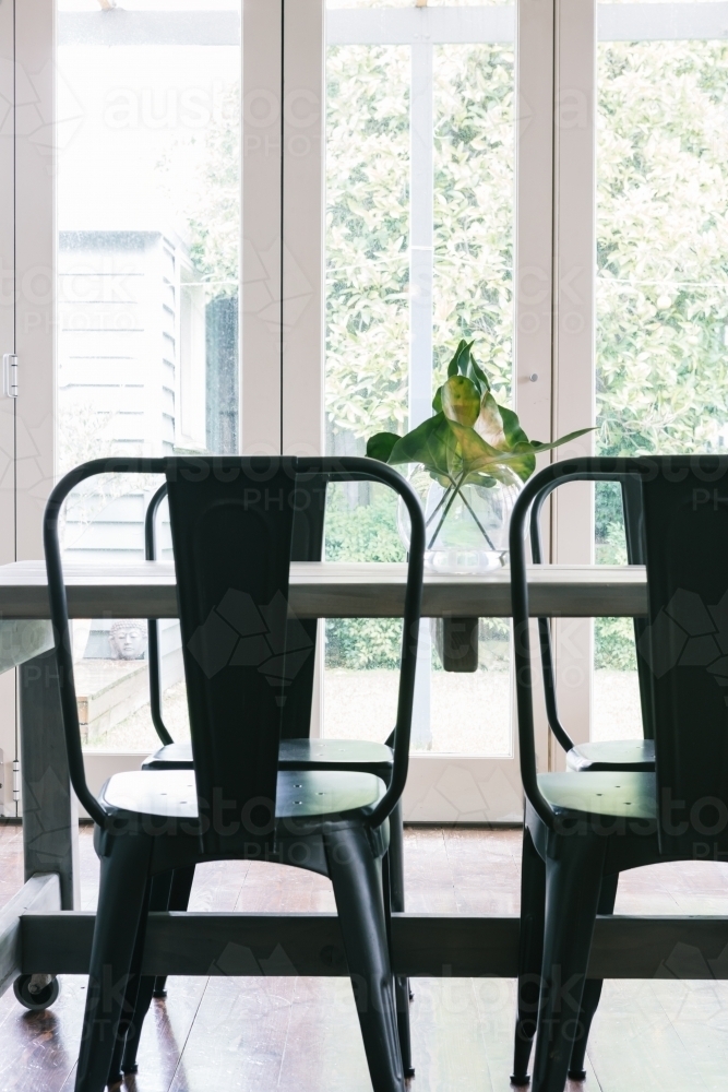 Close up vertical of black metal industrial styled dining table - Australian Stock Image