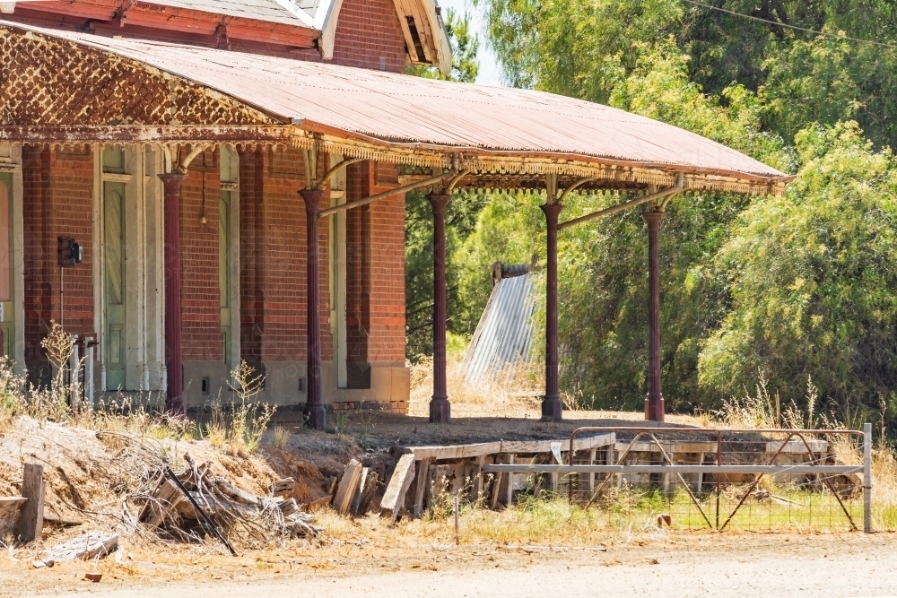 Close up view of an abandoned railway station with veranda and platform - Australian Stock Image