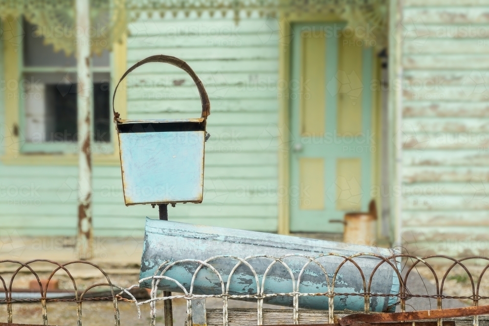 Closeup of a letter box on top of an old style wire fence - Australian Stock Image