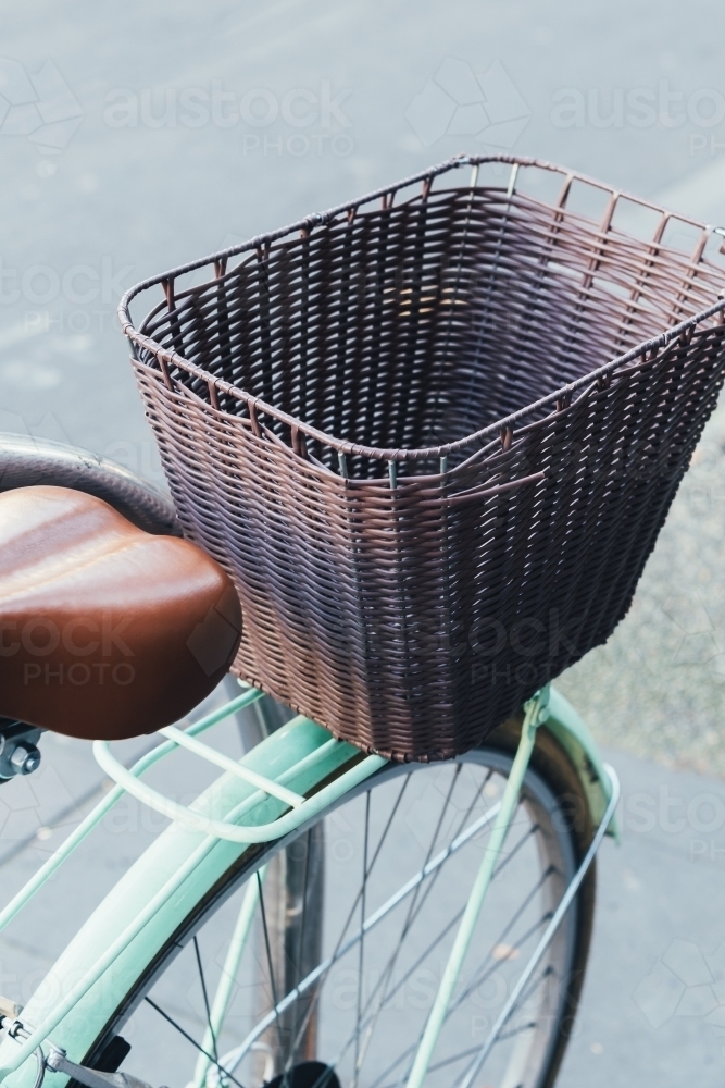 Closeup of a retro blue bicycle's basket. - Australian Stock Image