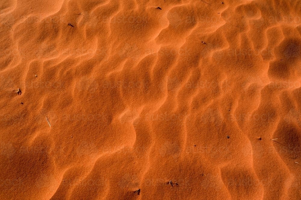 Closeup shot of deep orange desert sands with ripples - Australian Stock Image