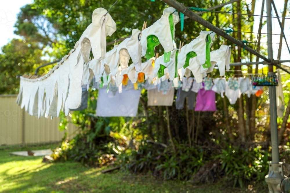 Cloth nappies hanging on clothes line. - Australian Stock Image