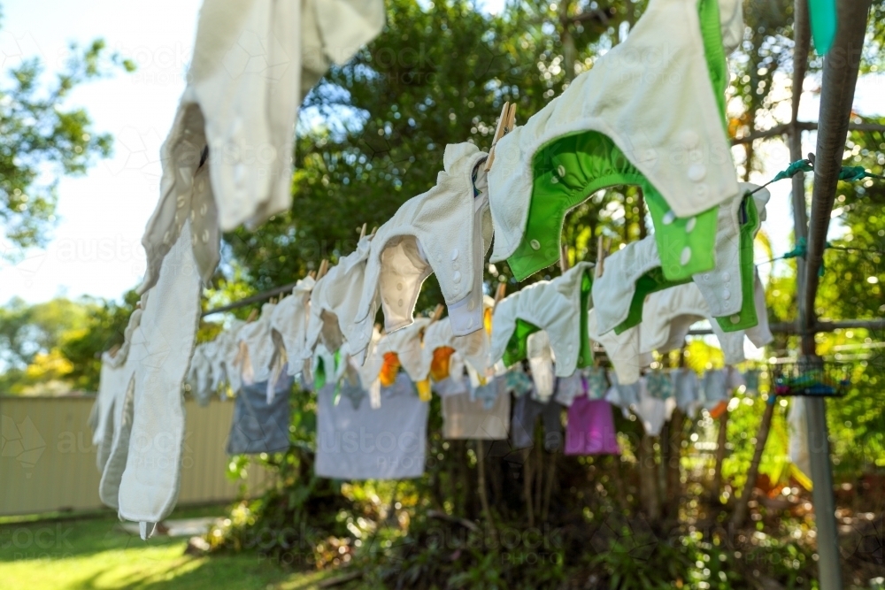 Cloth nappies hanging on clothes line. - Australian Stock Image