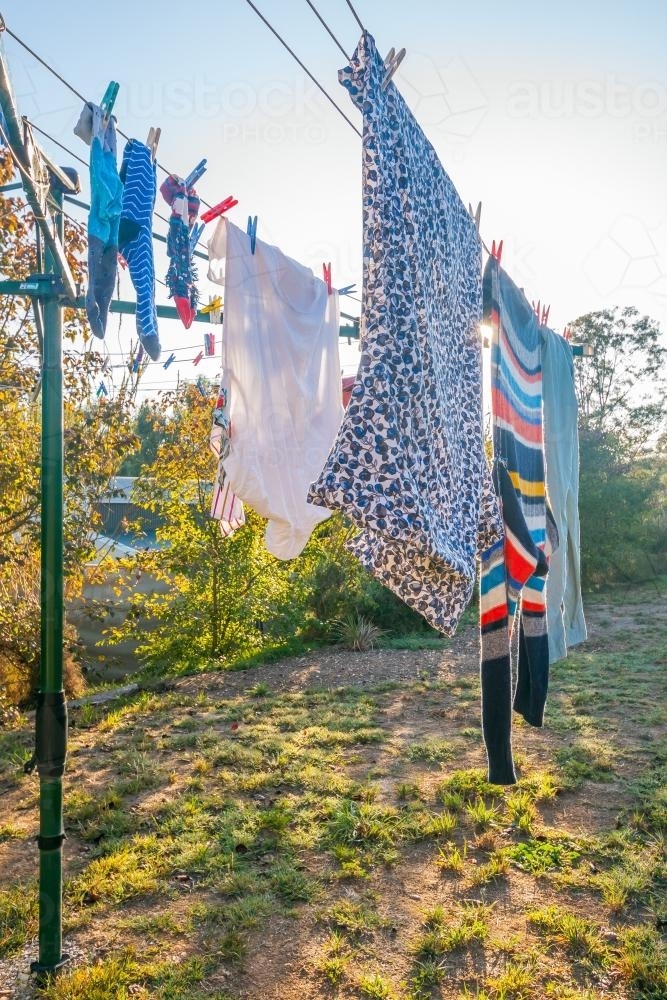 Clothes hanging outside on a clothes line - Australian Stock Image