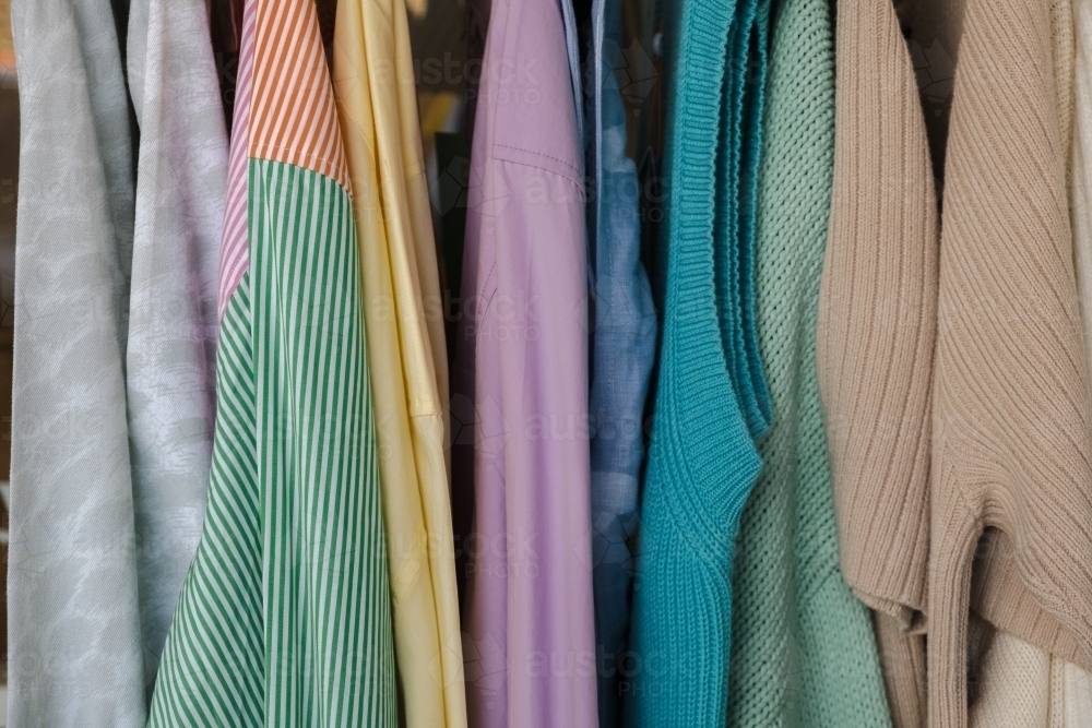 Image of Clothes on a rack close up - Austockphoto