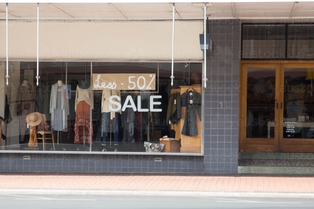 image of clothing store business window with sale sign austockphoto window sale sign