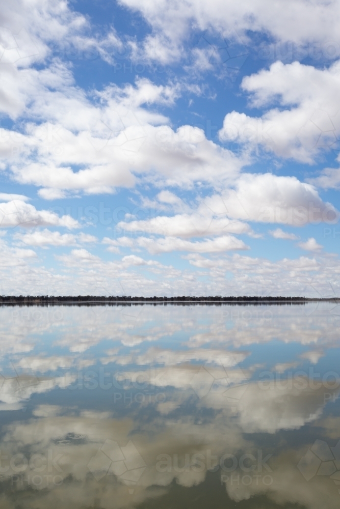 Cloud reflections on a lake like a mirror - Australian Stock Image