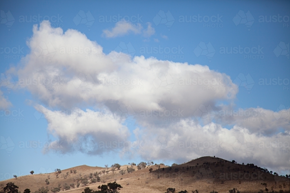 Clouds and hills on outskirts of Gundagai - Australian Stock Image