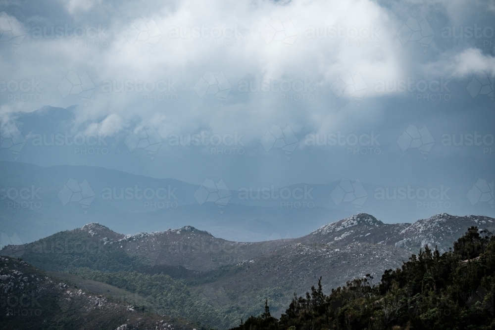 Cloudy sky over mountains in Tasmanian Central Highlands - Australian Stock Image