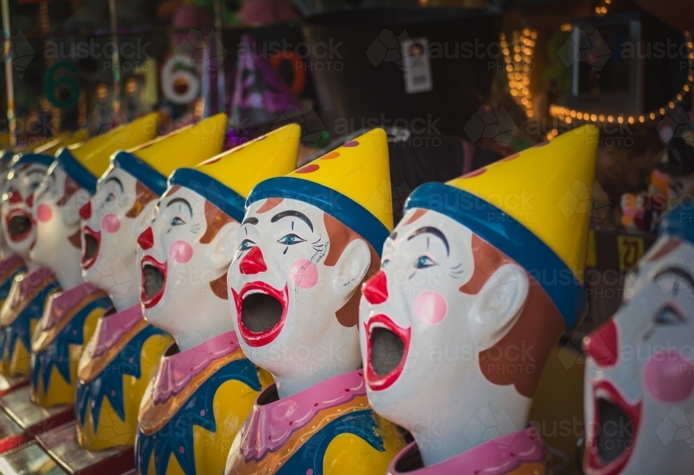 Clowns at a fair in an amusement park - Australian Stock Image