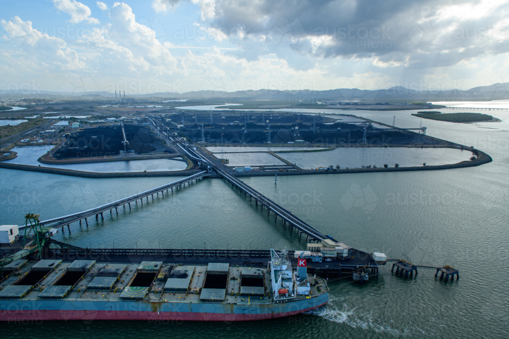Coal ship docked at the coal terminal wharf - Australian Stock Image
