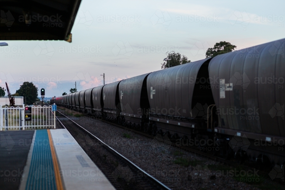 Coal train passing Singleton station in the Hunter Valley - Australian Stock Image