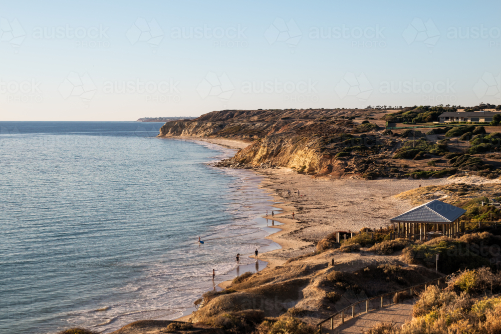 Coastal bay with people on beach, Port Willunga Beach, South Australia - Australian Stock Image