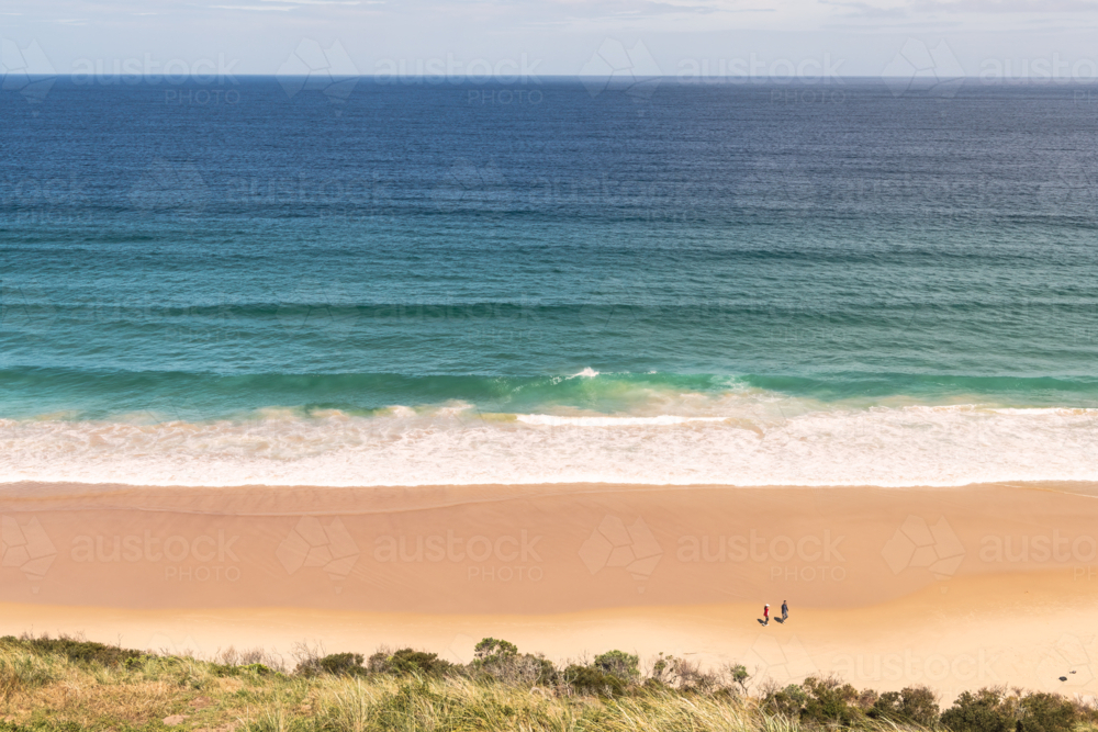 Coastal landscape shot of white sandy beach with surf - Australian Stock Image