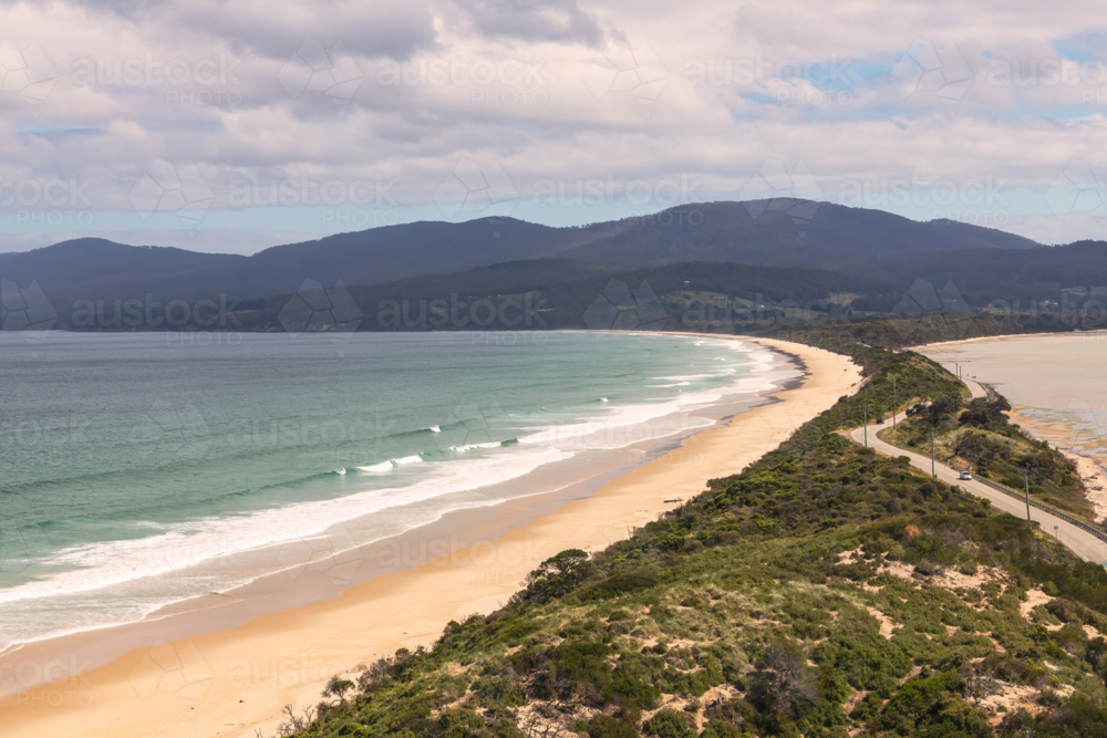 Coastal landscape shot of white sandy beach with surf - Australian Stock Image