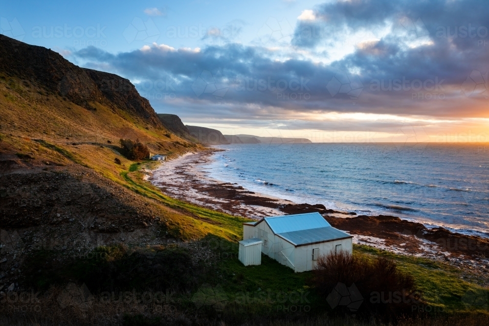 Coastal shack on water's edge - Australian Stock Image