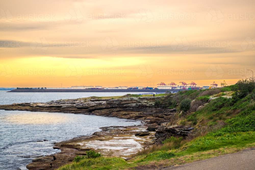 coastal sunset at La Perouse with Port Botany at the horizon - Australian Stock Image