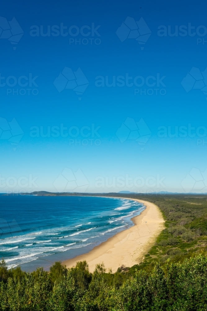 Coastline of NSW, with blue skies and rolling surf - Australian Stock Image