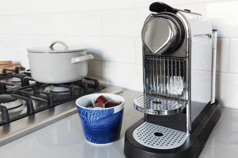Coffee pod machine on a kitchen benchtop in a home - Australian Stock Image