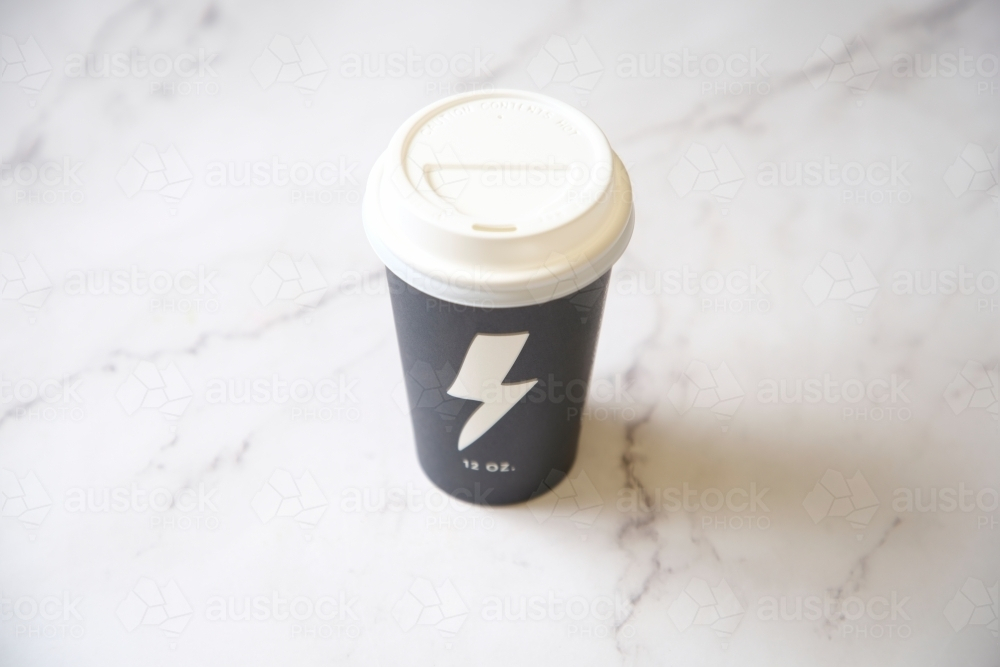 Coffee takeaway cup on marble surface - Australian Stock Image