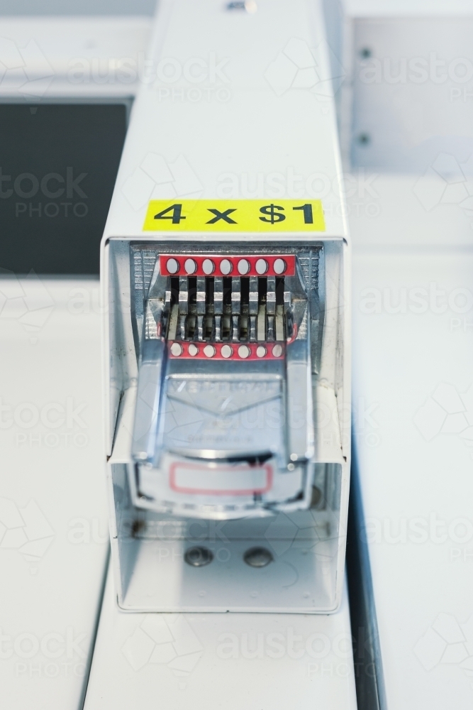 Coin slot in a laundromat - Australian Stock Image