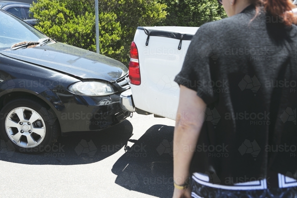 Collision of cars close up with onlooker - Australian Stock Image