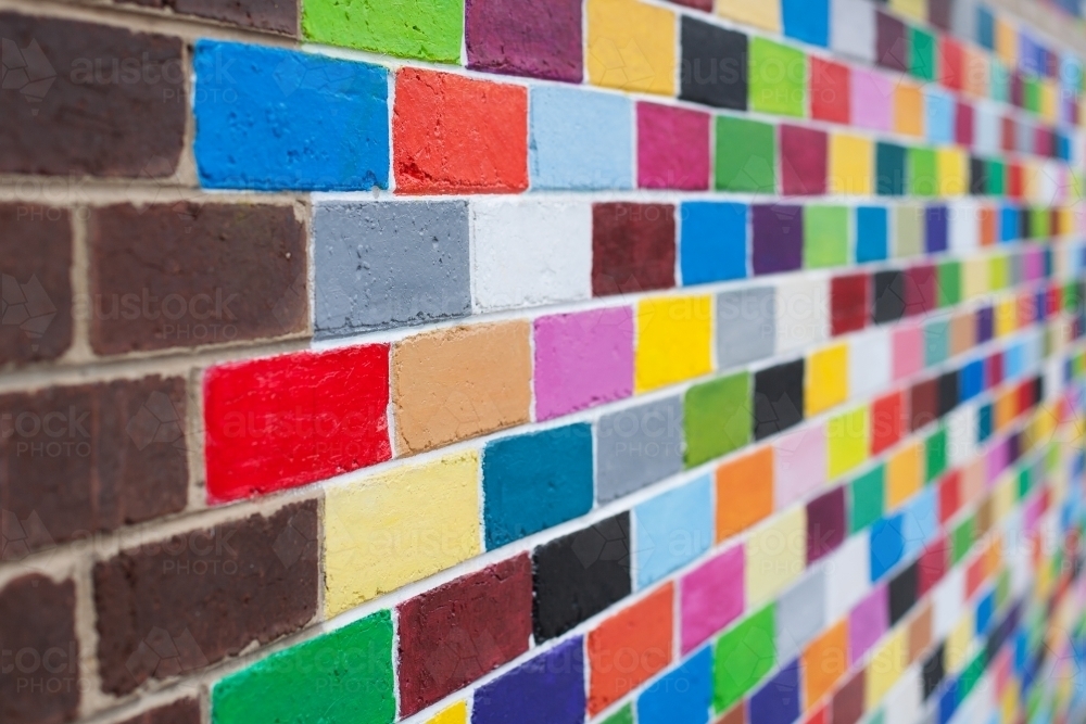 Coloured brick wall on a city street - Australian Stock Image