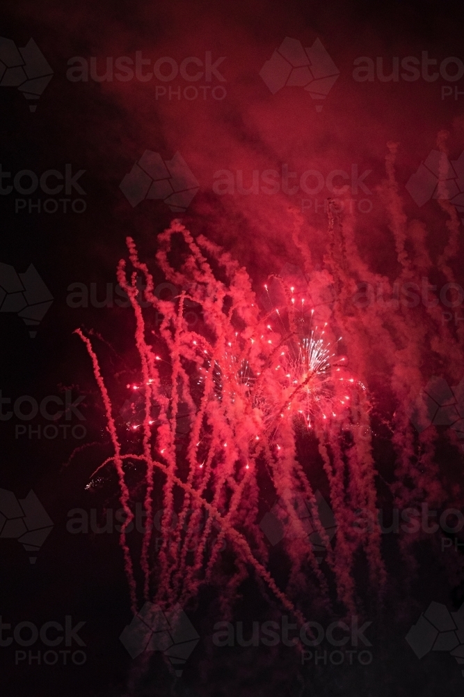Colourful fireworks display in sky at night - Australian Stock Image