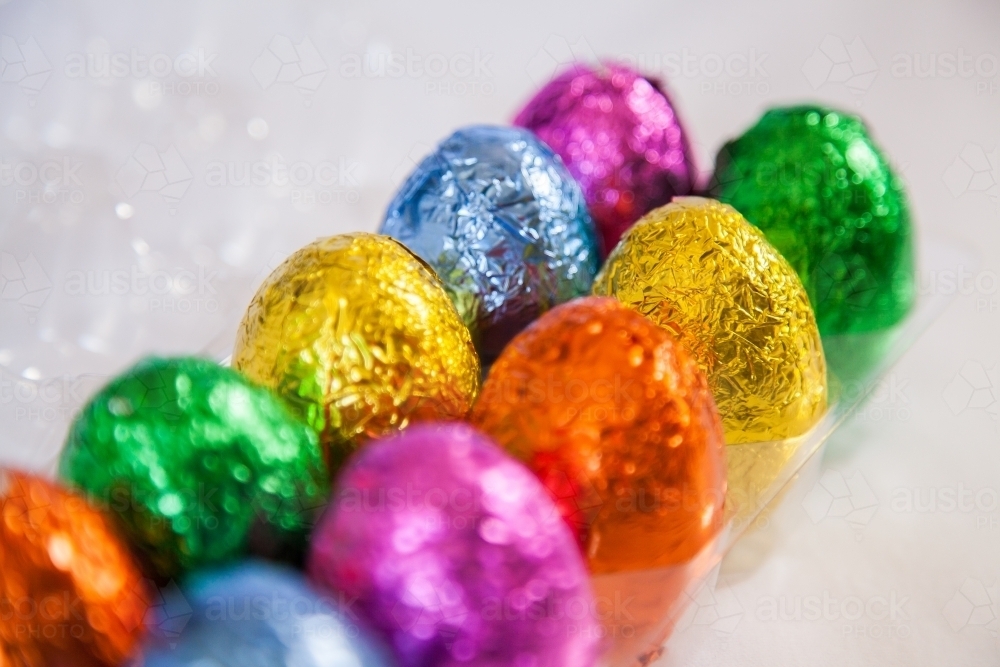 Colourful, foil wrapped Easter eggs in rows - Australian Stock Image