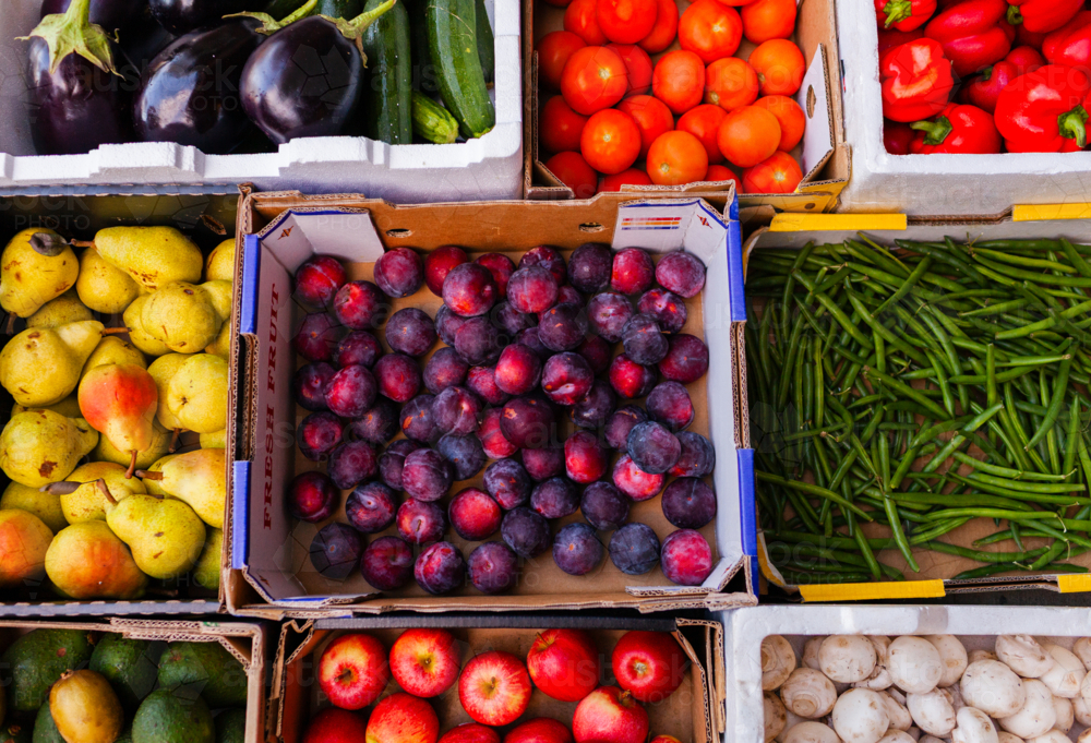 Colourful fresh organic fruit and veg straight from farmers in boxes delivered to hub - Australian Stock Image