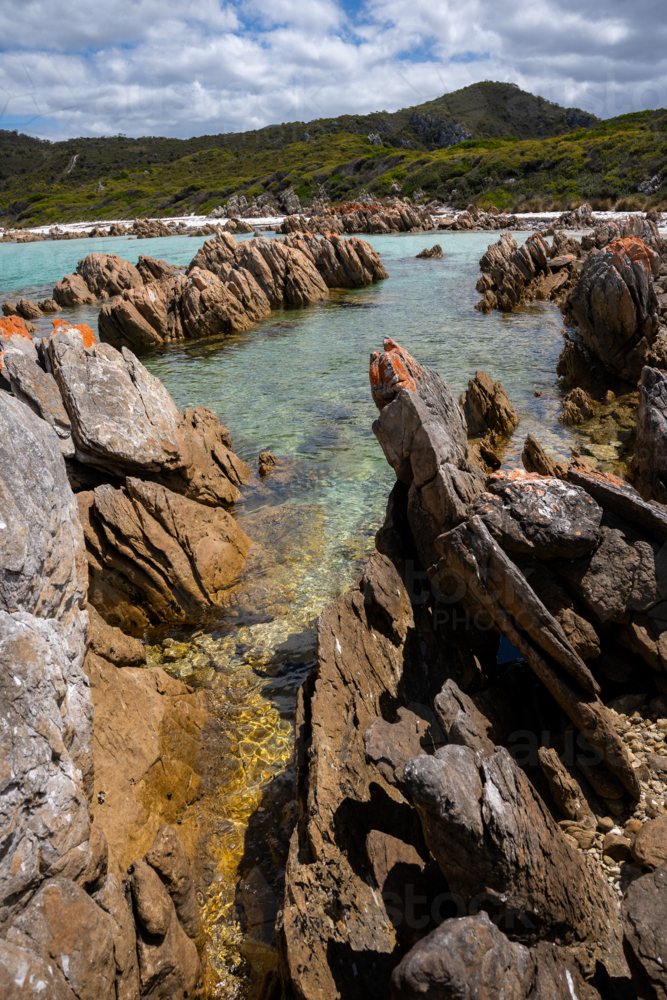 Colourful rocks and shore of the Rocky Cape National Park - Australian Stock Image