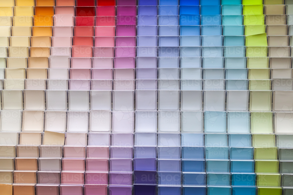 Colourful rows of house paint sample cards at hardware shop - Australian Stock Image