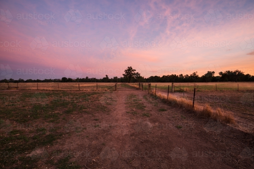 Colourful sunrise landscape of farming paddocks - Australian Stock Image