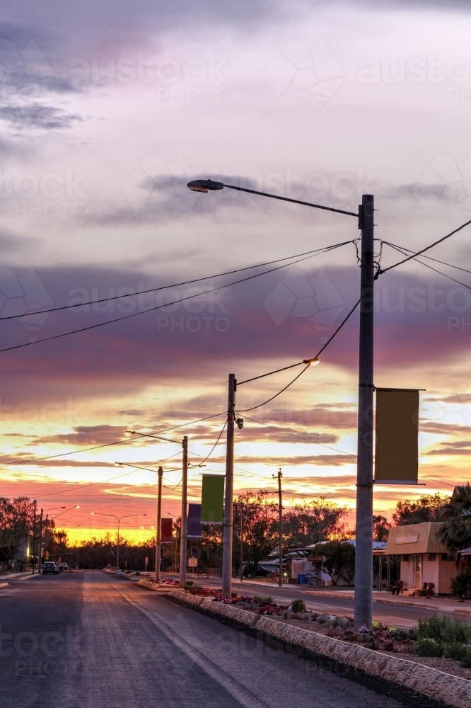 Colourful sunrise over street in a country town. - Australian Stock Image