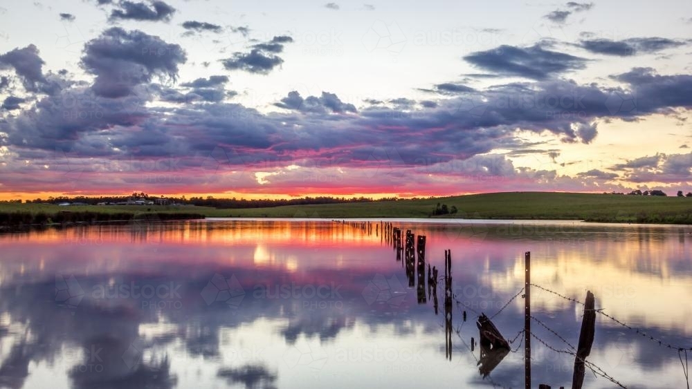 Colourful sunset over country dam - Australian Stock Image