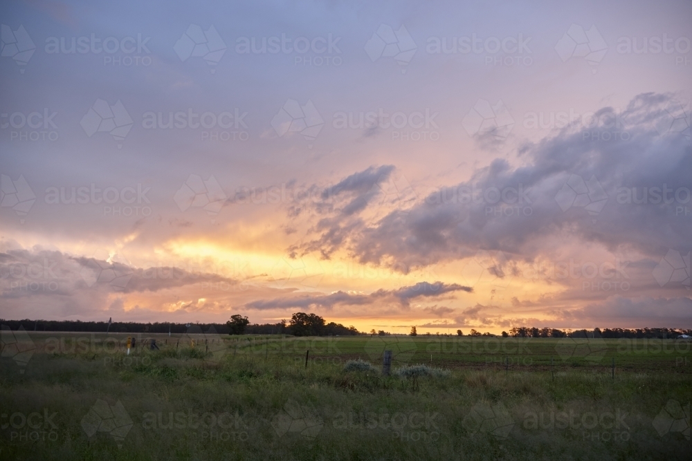 Colourful sunset over farmland - Australian Stock Image